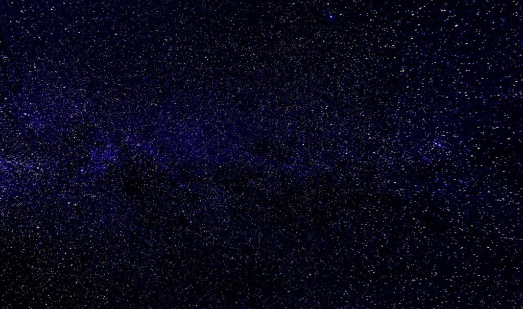 Explore the vast universe with this beautiful night sky filled with stars and galaxies.