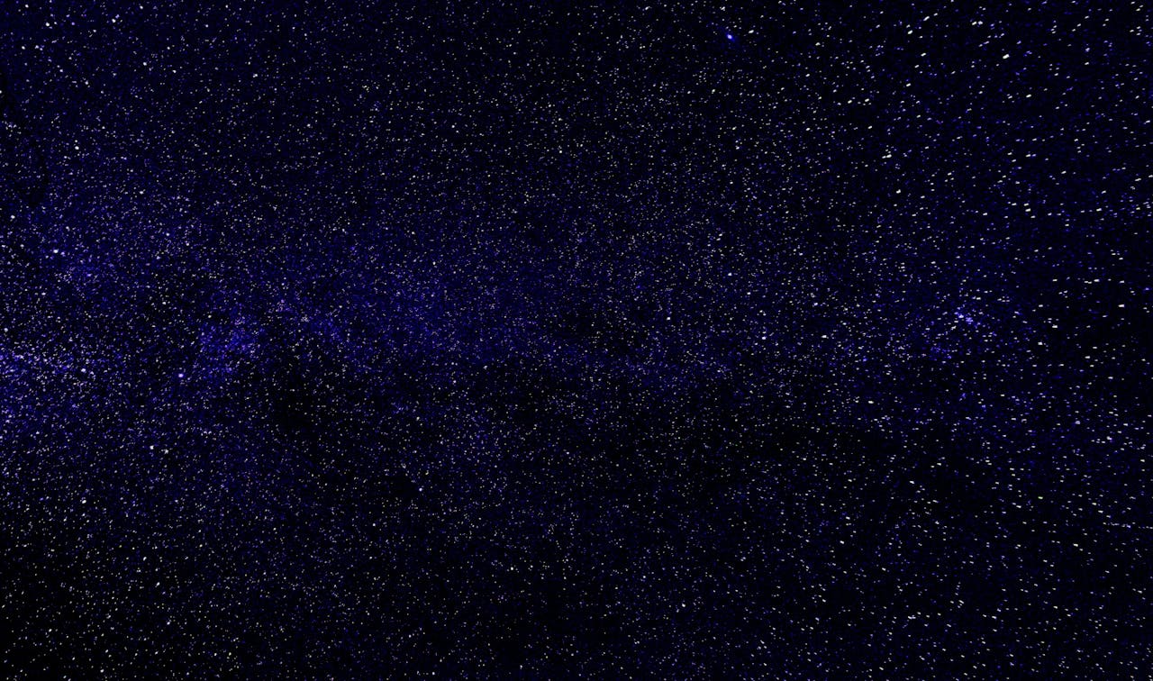 Explore the vast universe with this beautiful night sky filled with stars and galaxies.